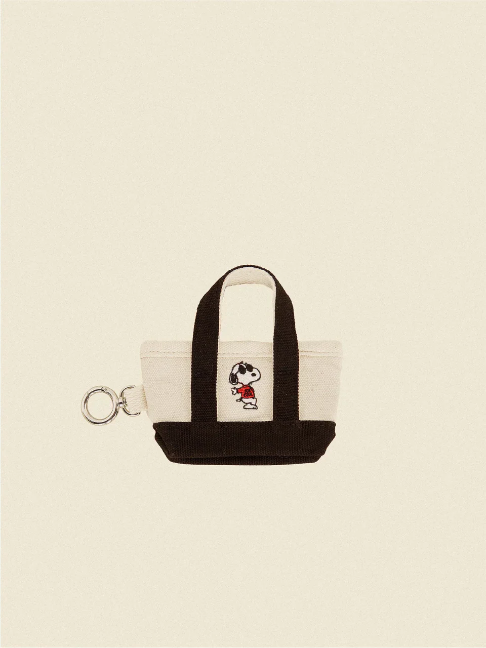 The Little Beast Snoopy Poop Bag Tote in Black or Red